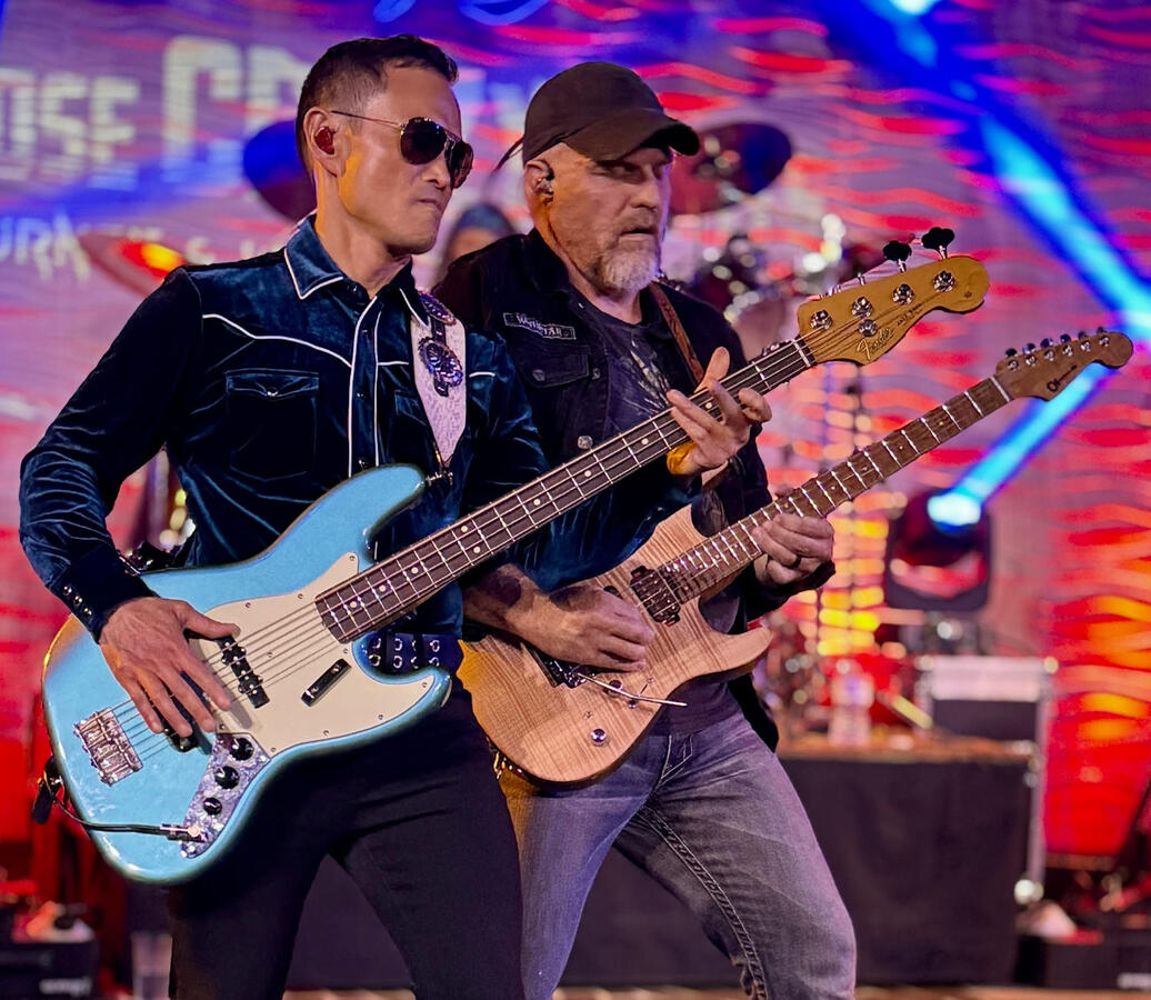 OrrickBass and guitarist Chris trading riffs during Journey tribute show at Nissi's Entertainment and Event Center